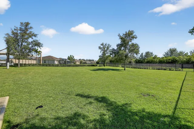 a view of a golf course with a lake