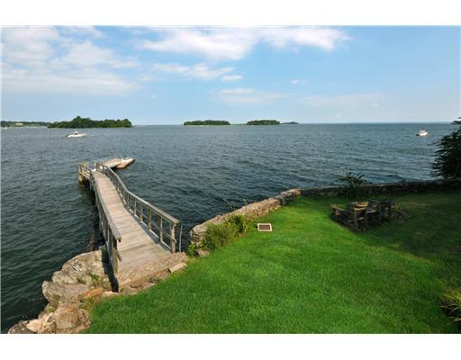 125 Byram Shore Road Greenwich, CT 06830 - Photo 2 of 8 a view of a lake with a yard