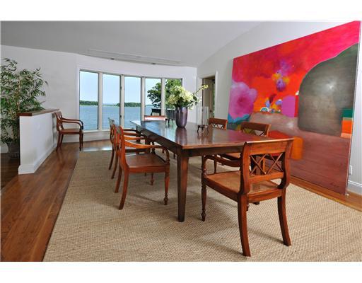 125 Byram Shore Road Greenwich, CT 06830 - Photo 6 of 8 a view of a dining room with furniture and wooden floor