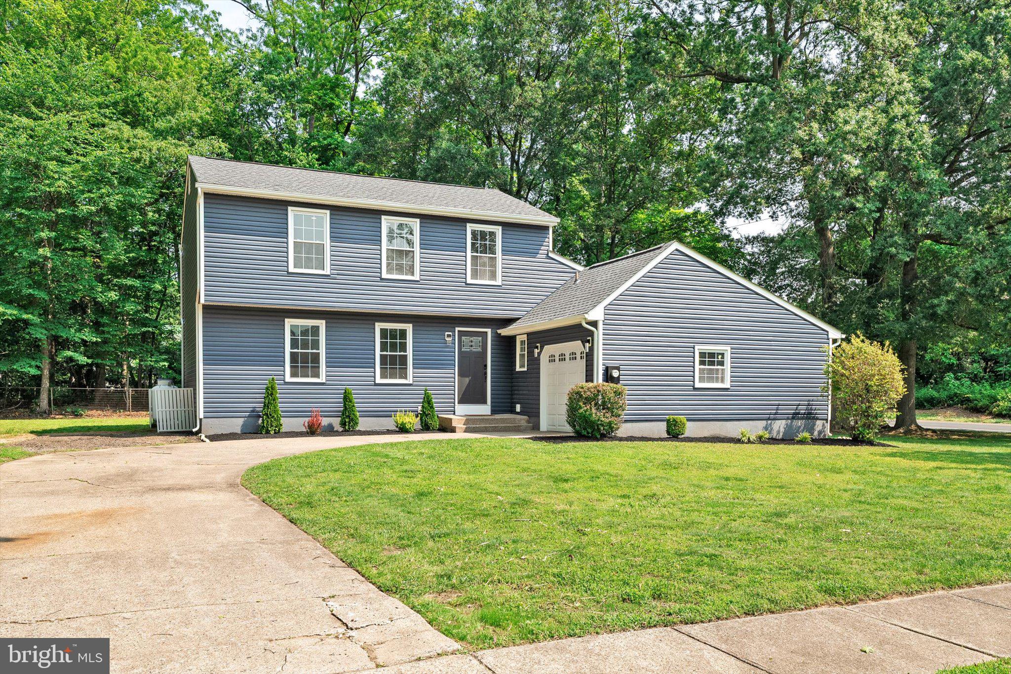 2 Tall Timber Lane Burlington, NJ 08016 - Photo 1 of 30 a front view of house with yard and green space