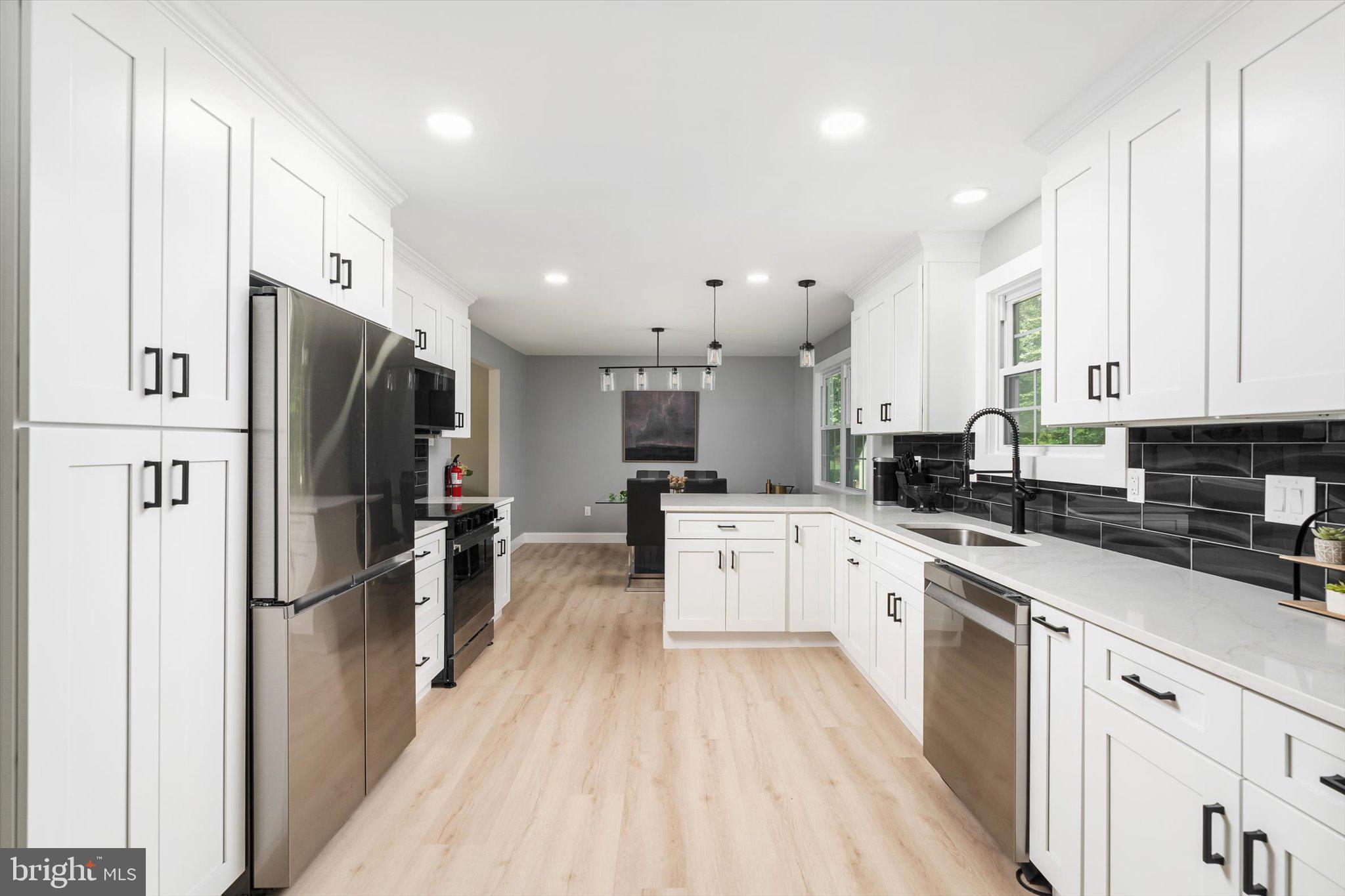 2 Tall Timber Lane Burlington, NJ 08016 - Photo 14 of 30 a large kitchen with stainless steel appliances and refrigerator