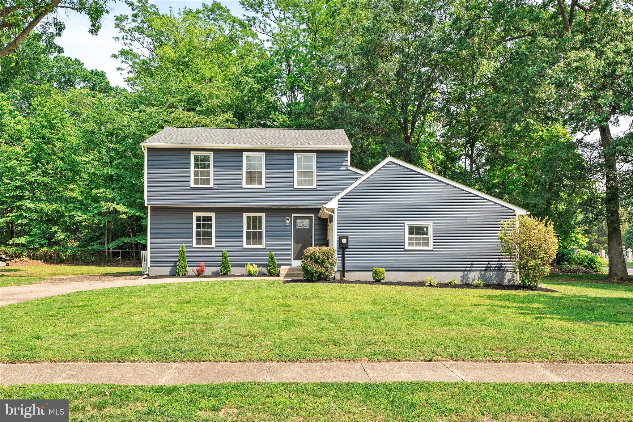 2 Tall Timber Lane Burlington, NJ 08016 - Photo 2 of 30 a front view of house with yard and green space