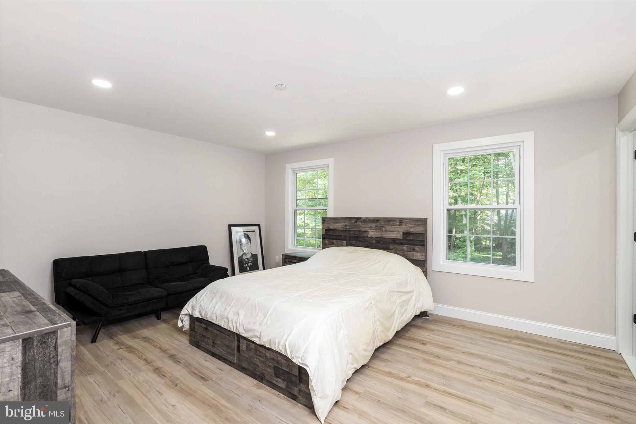 2 Tall Timber Lane Burlington, NJ 08016 - Photo 25 of 30 a bedroom with a bed lamp and a window
