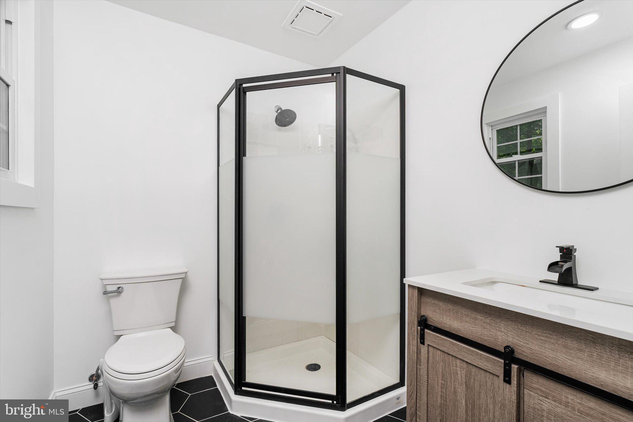 2 Tall Timber Lane Burlington, NJ 08016 - Photo 27 of 30 a bathroom with a toilet a sink and mirror