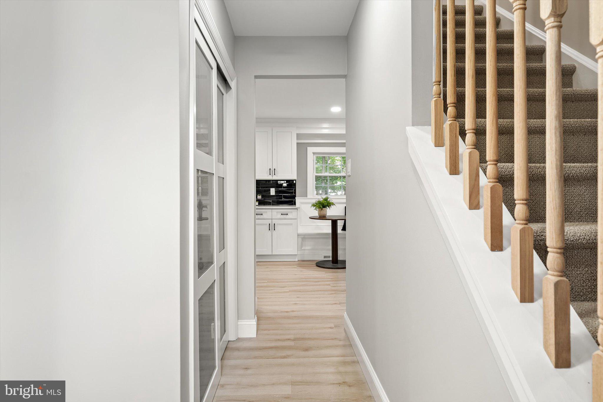 2 Tall Timber Lane Burlington, NJ 08016 - Photo 28 of 30 a hallway with a white cabinets and wooden floor