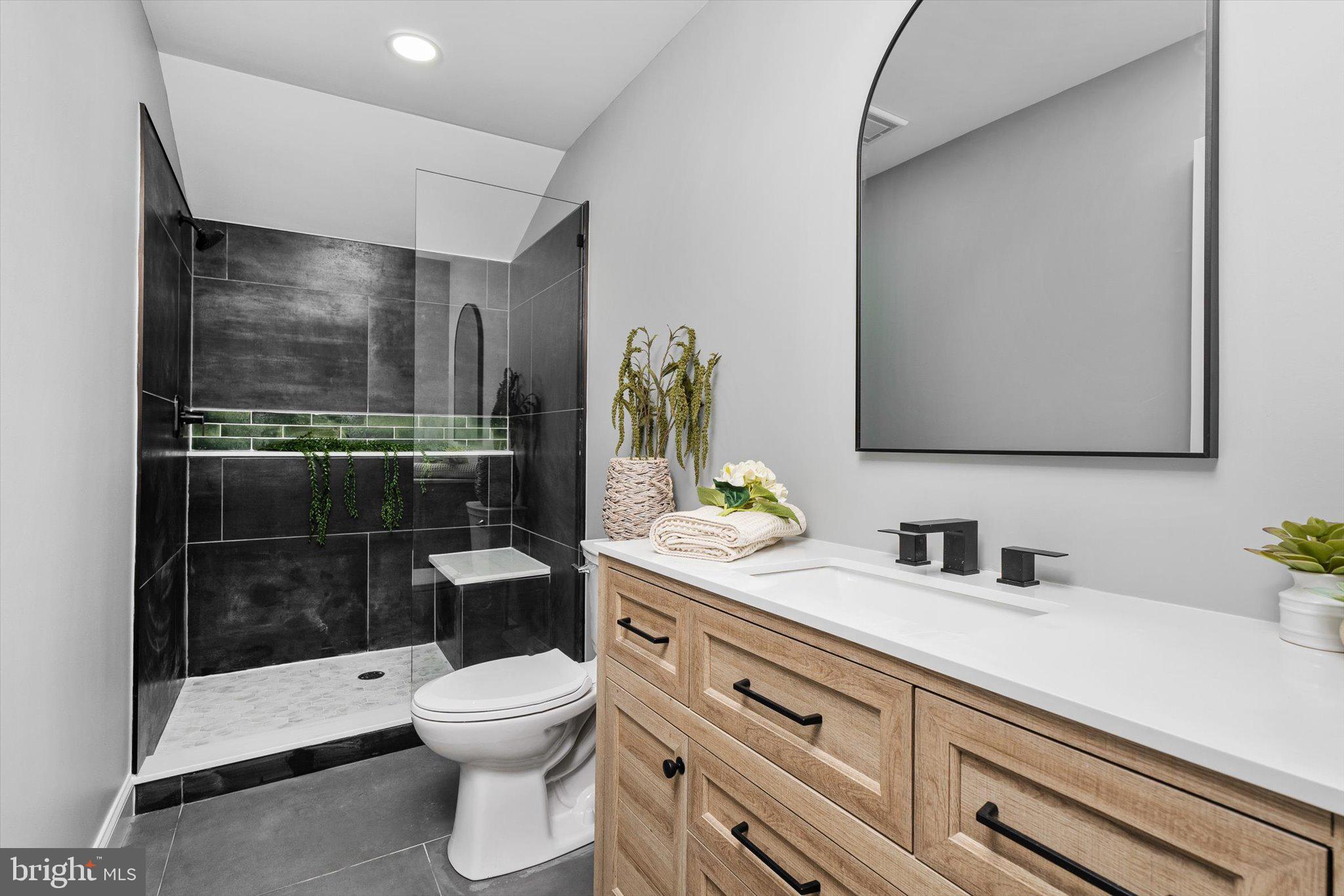 2 Tall Timber Lane Burlington, NJ 08016 - Photo 29 of 30 a bathroom with a toilet a sink and glass door