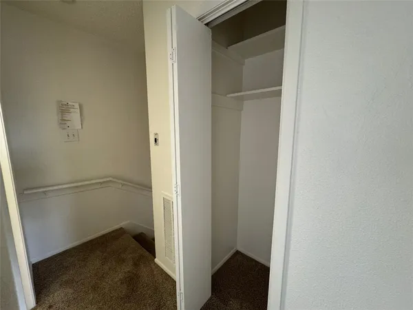 a view of small space with racks on the wall