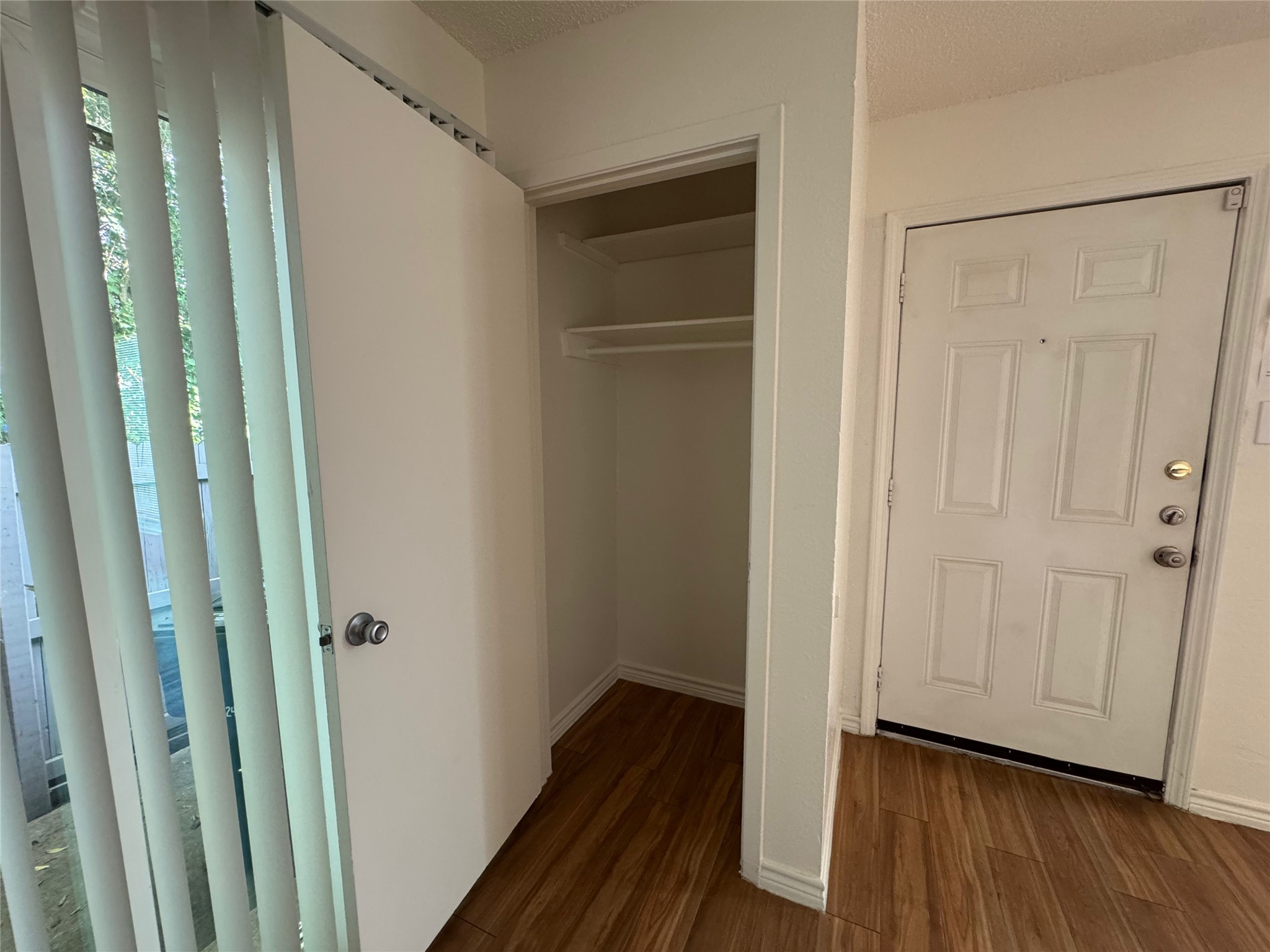 4810 West Wind Trail, Unit 101 Austin, TX 78745 - Photo 8 of 21 a view of a hallway with wooden floor