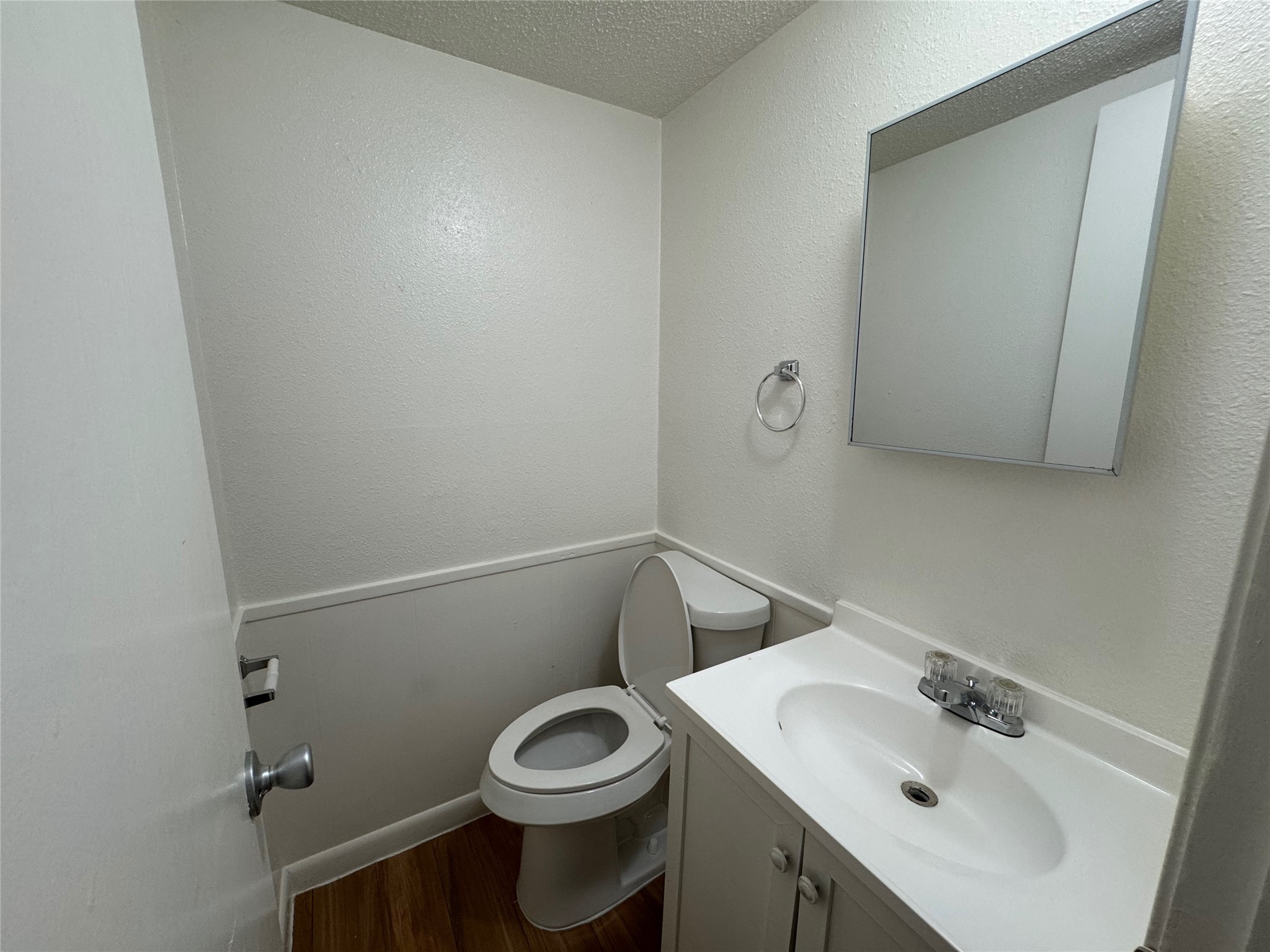 4810 West Wind Trail, Unit 101 Austin, TX 78745 - Photo 9 of 21 a bathroom with a sink a toilet and mirror