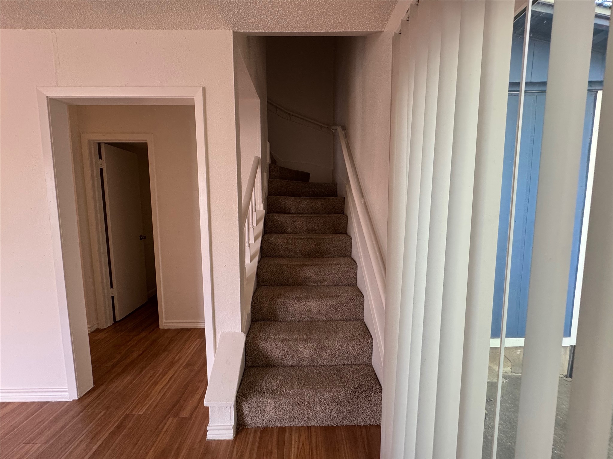 4810 West Wind Trail, Unit 101 Austin, TX 78745 - Photo 10 of 21 a view of entryway and hall with wooden floor
