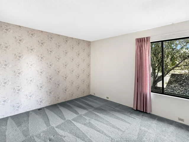 a view of a room with a large window