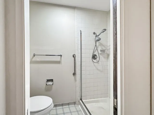 a view of a room with wooden floor