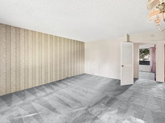 a view of a house with a door and wooden floor