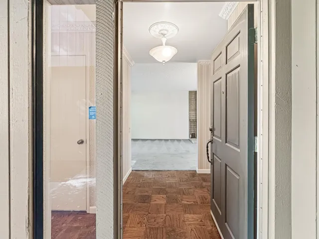 a bathroom with a glass shower door and a glass door