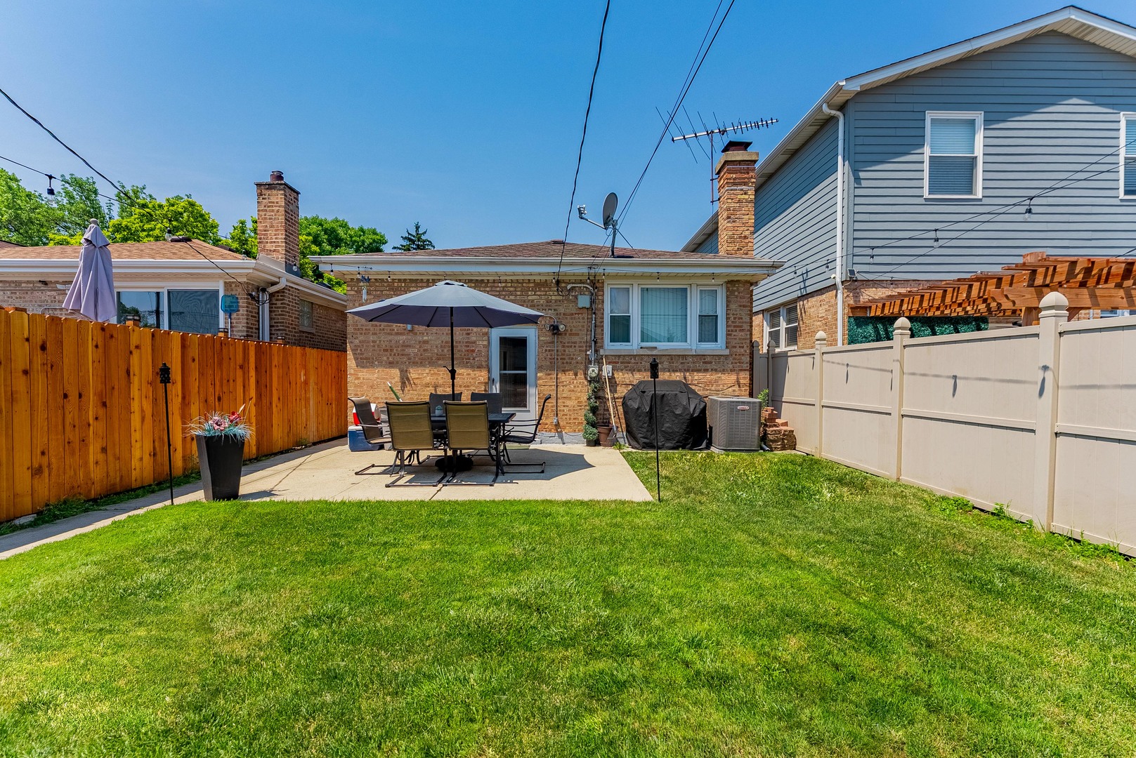 6031 South Normandy Avenue Chicago, IL 60638 - Photo 25 of 26 a view of a house with backyard and porch