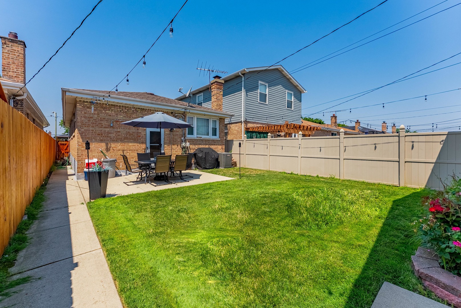 6031 South Normandy Avenue Chicago, IL 60638 - Photo 26 of 26 a front view of a house with garden