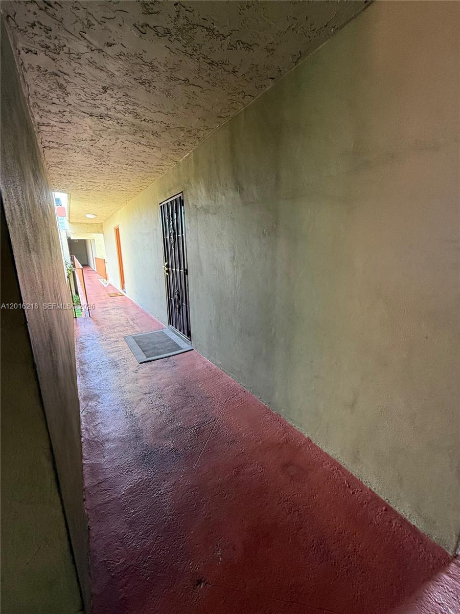 9321 Southwest 4th Street, Unit 230C Miami, FL 33174 - Photo 2 of 37 a view of hallway with stairs