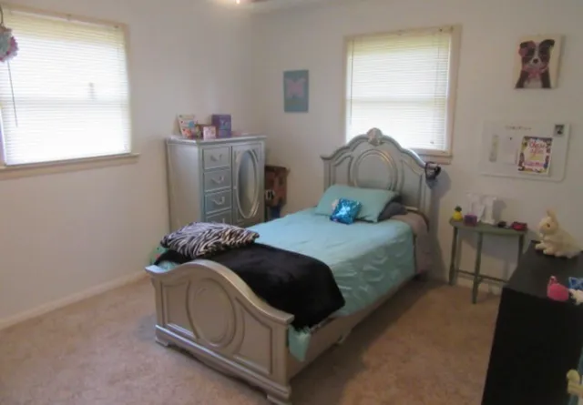 a kitchen with stainless steel appliances granite countertop a sink stove and microwave