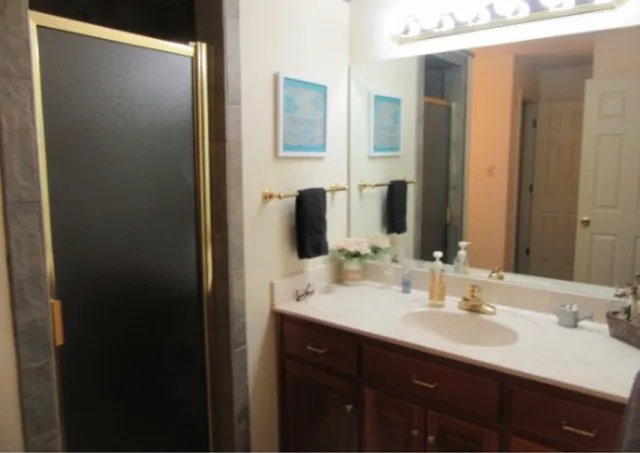a bathroom with a double vanity sink and a mirror