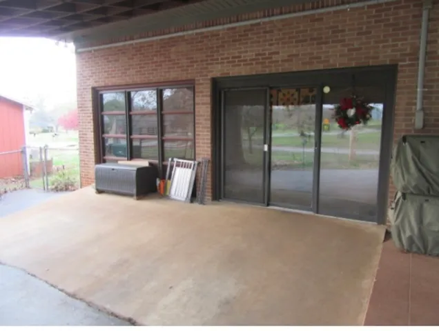 a living room with lots of furniture and a baby crib