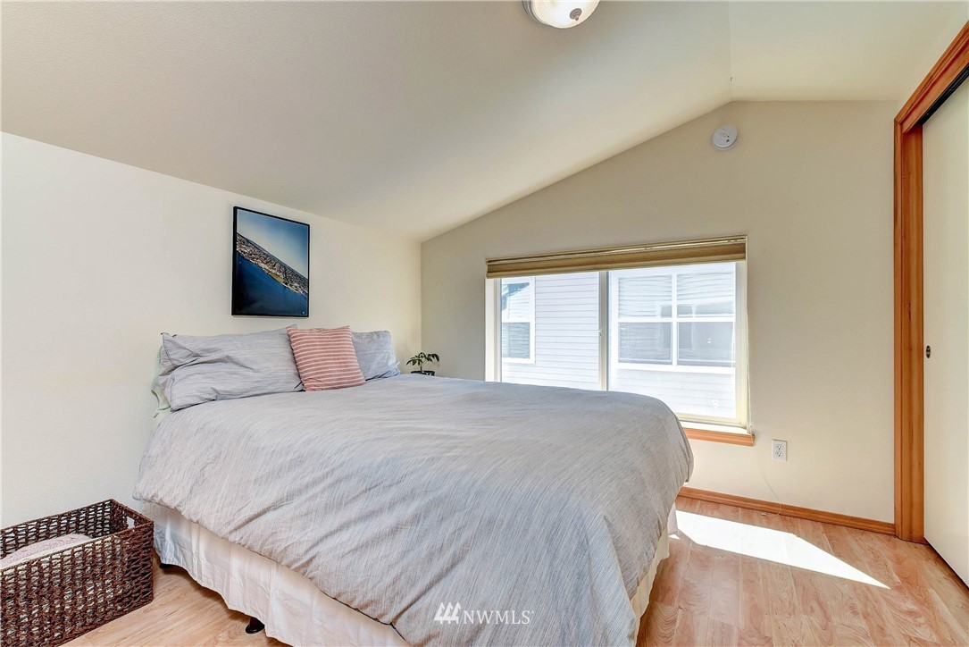 1311 North 145th Street, Unit B Seattle, WA 98133 - Photo 17 of 31 a bedroom with a bed and a window