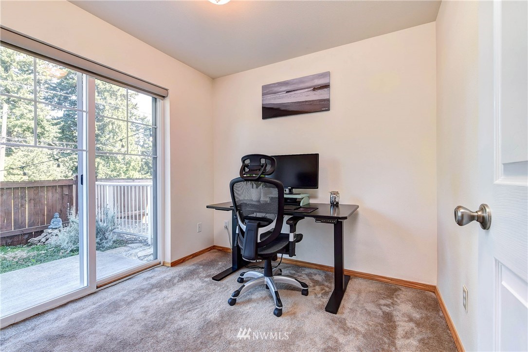 1311 North 145th Street, Unit B Seattle, WA 98133 - Photo 22 of 31 a view of a workspace with furniture and a window