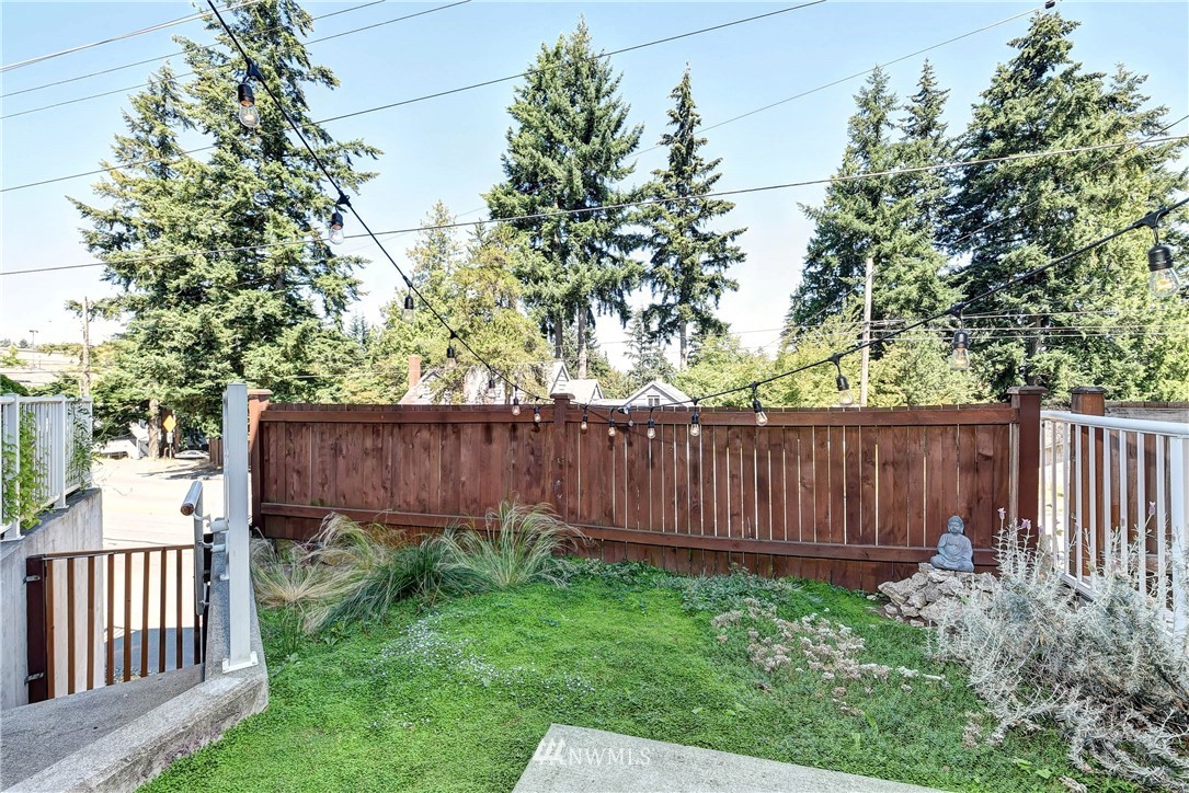 1311 North 145th Street, Unit B Seattle, WA 98133 - Photo 24 of 31 a view of a backyard with wooden fence