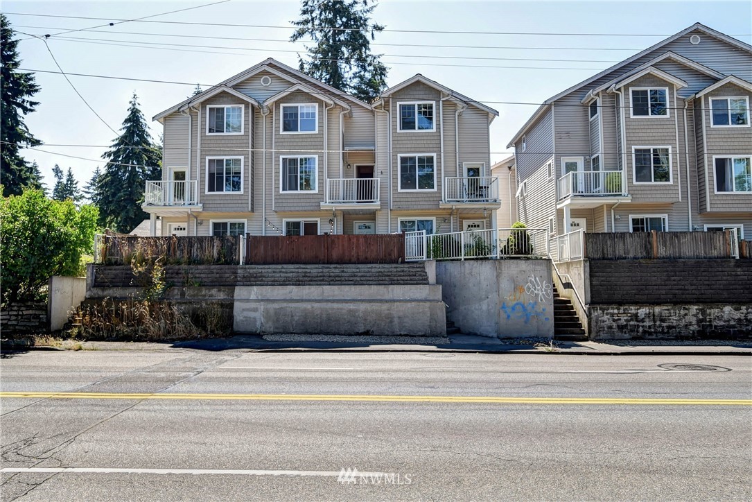 1311 North 145th Street, Unit B Seattle, WA 98133 - Photo 31 of 31 a view of a house with a yard and potted plants