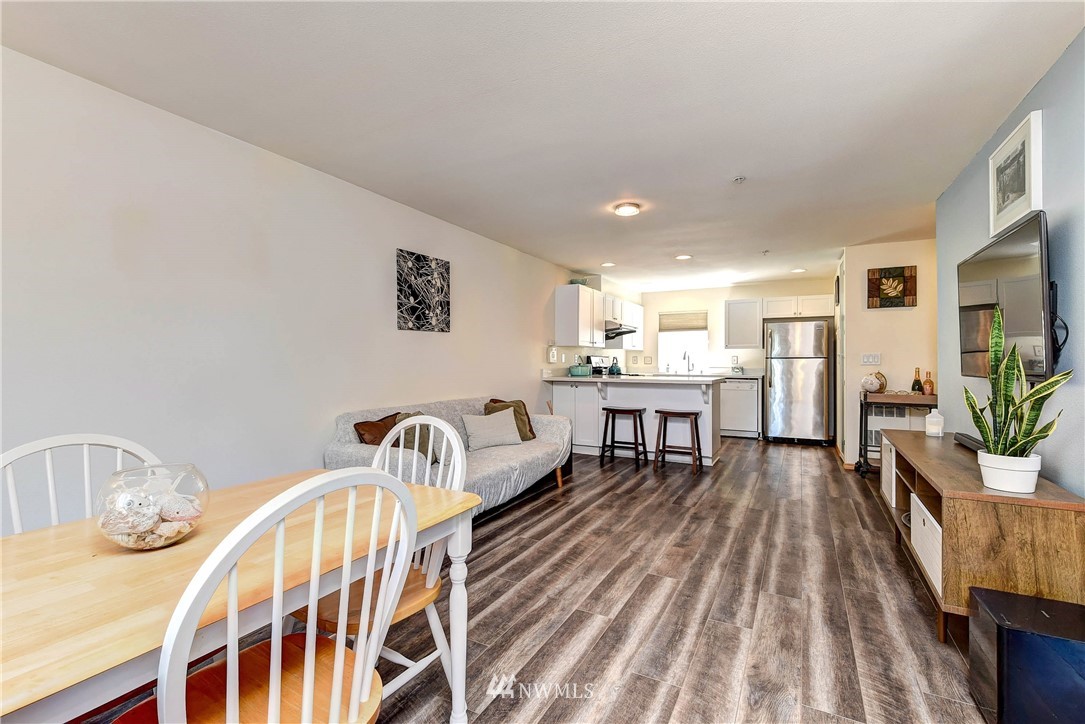 1311 North 145th Street, Unit B Seattle, WA 98133 - Photo 10 of 31 a living room with furniture and a table
