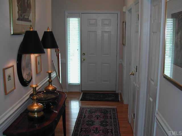 2505 Clerestory Place Raleigh, NC 27615 - Photo 2 of 10 a bedroom with a bed and a mirror