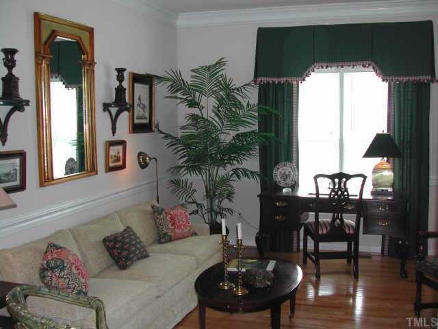 2505 Clerestory Place Raleigh, NC 27615 - Photo 3 of 10 a living room with furniture and a potted plant