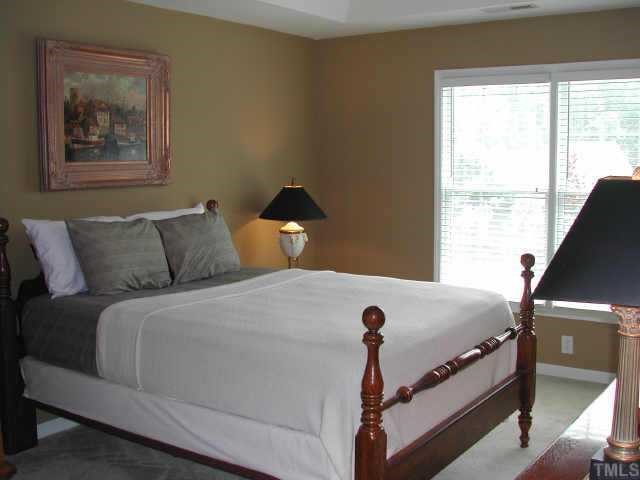 2505 Clerestory Place Raleigh, NC 27615 - Photo 7 of 10 a bedroom with a bed and window