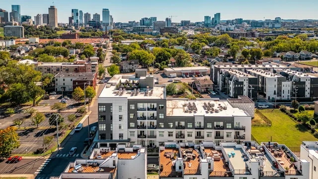 an aerial view of residential houses with outdoor space