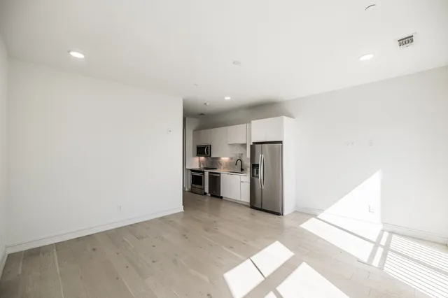 a view of a kitchen with a sink and an oven