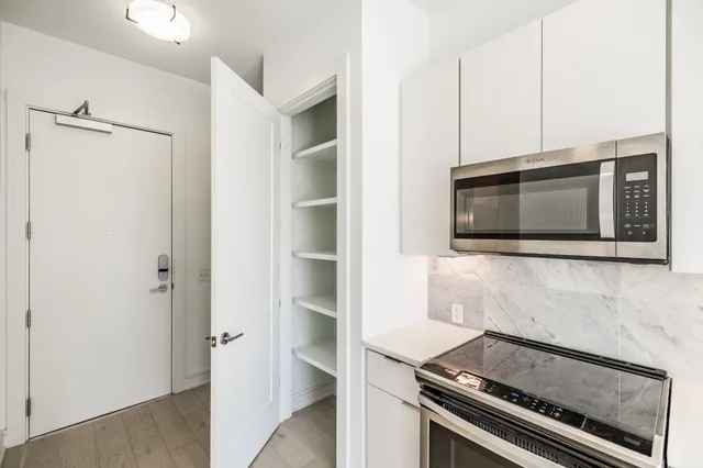 a kitchen with a stove and a microwave