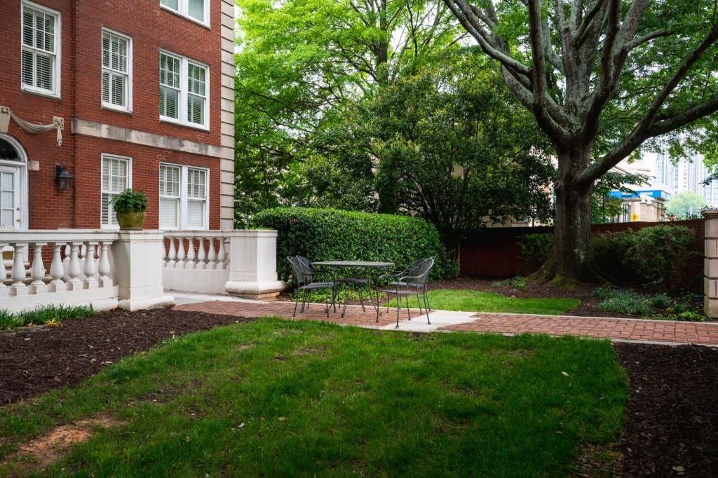 2840 Peachtree Road, Unit 503 Atlanta, GA 30305 - Photo 12 of 46 a view of a chair and table in the garden