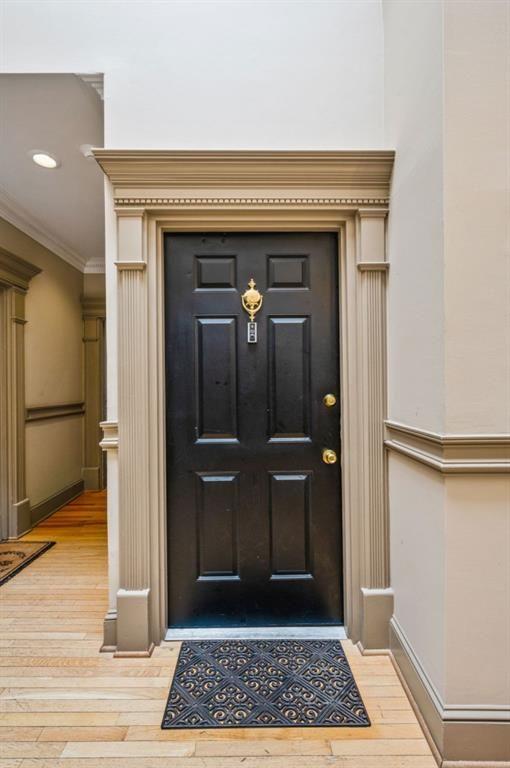 2840 Peachtree Road, Unit 503 Atlanta, GA 30305 - Photo 15 of 46 a view of a hallway with a glass door and wooden floor