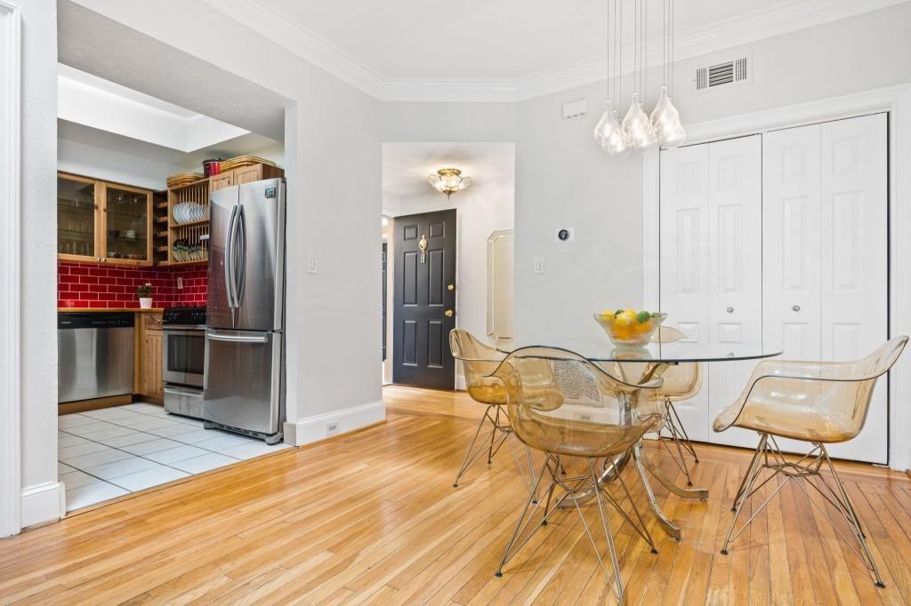 2840 Peachtree Road, Unit 503 Atlanta, GA 30305 - Photo 16 of 46 a view of a dining room with furniture and wooden floor