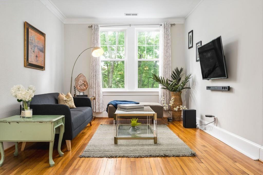 2840 Peachtree Road, Unit 503 Atlanta, GA 30305 - Photo 21 of 46 a living room with furniture and a flat screen tv