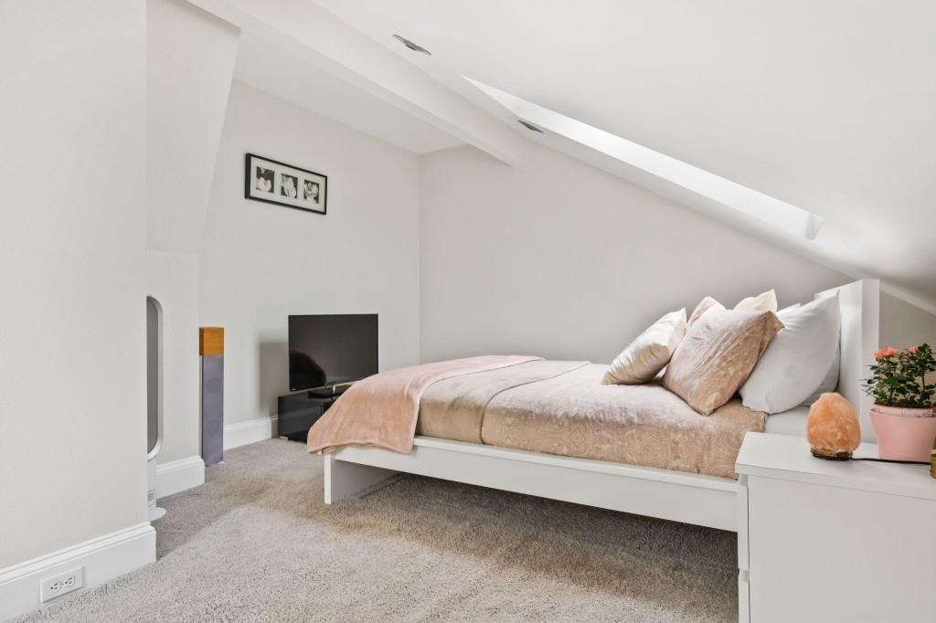 2840 Peachtree Road, Unit 503 Atlanta, GA 30305 - Photo 33 of 46 a bedroom with bed and a table