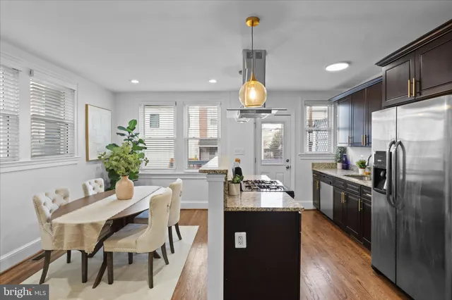 a kitchen with cabinets a sink and appliances