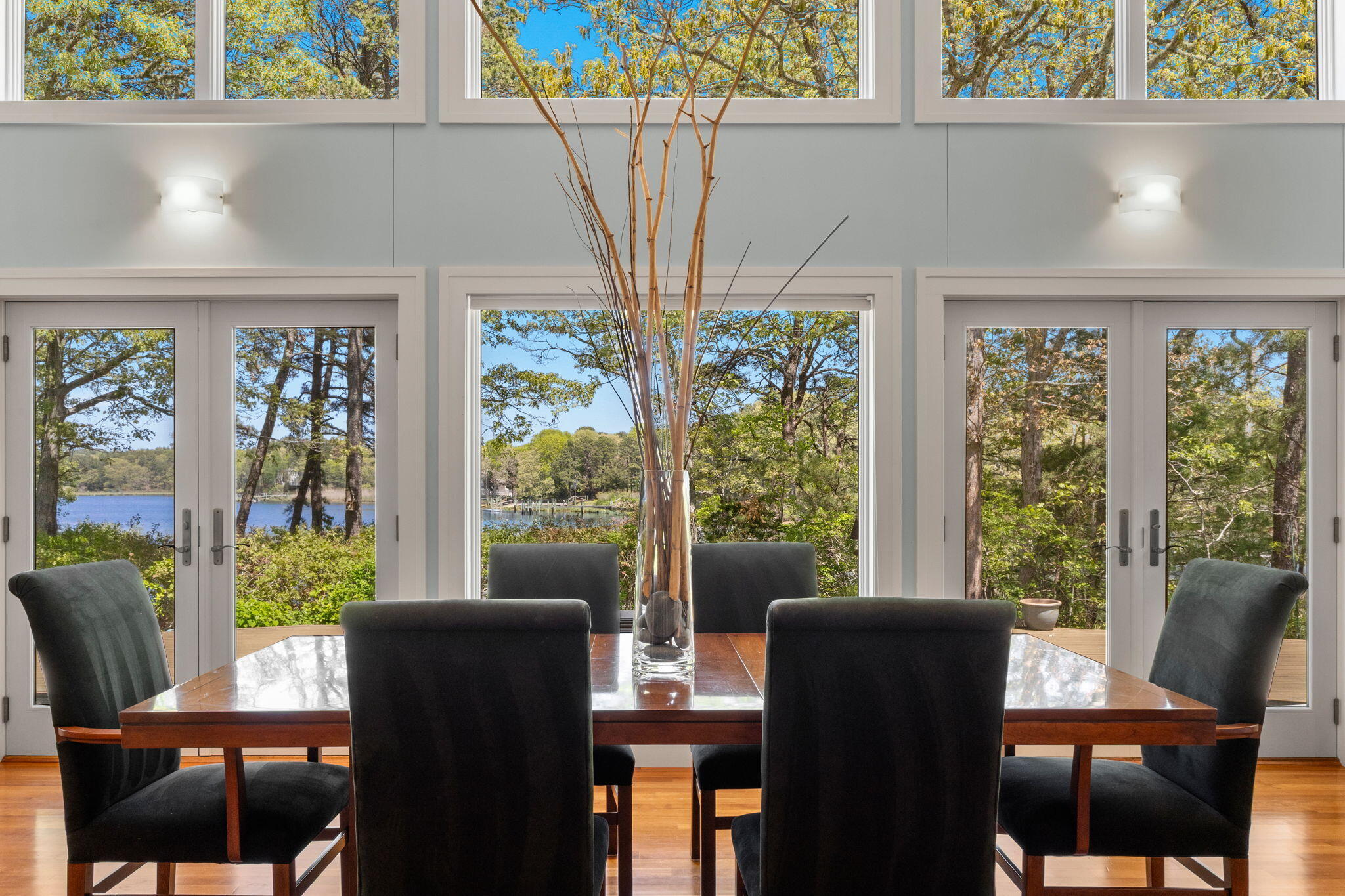 476 Baxter Neck Road Marstons Mills, MA 02648 - Photo 14 of 95 a view of a dining room with furniture large windows and wooden floor