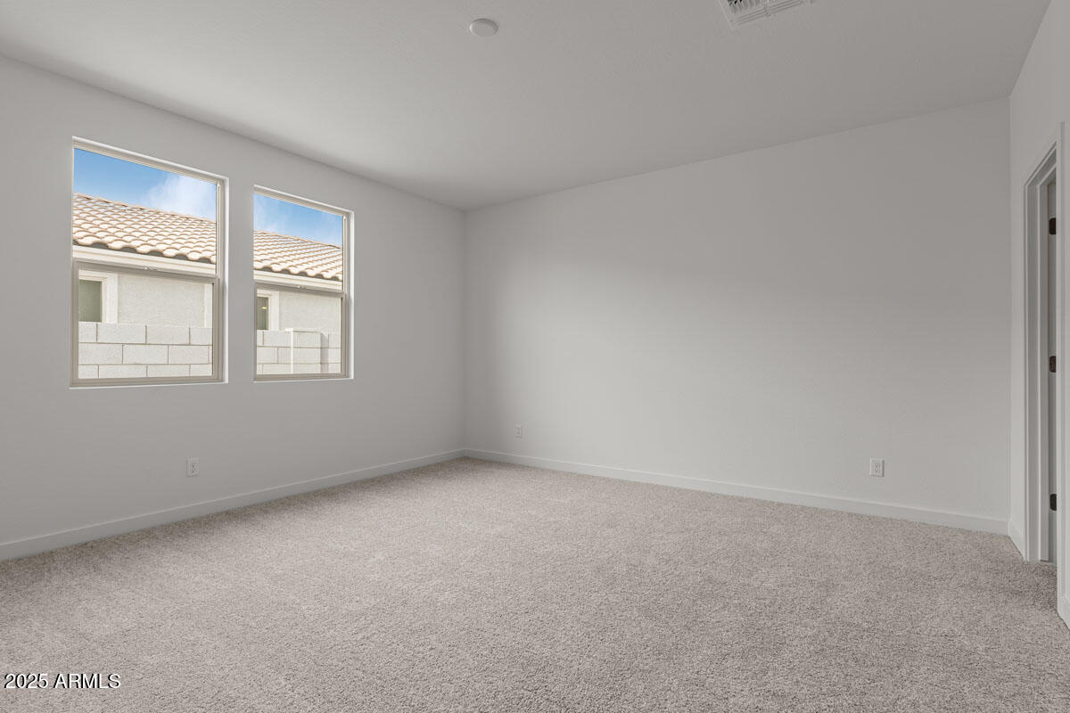 18168 West Pima Street Goodyear, AZ 85338 - Photo 12 of 21 a view of an empty room with a window