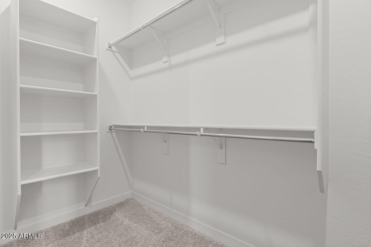 18168 West Pima Street Goodyear, AZ 85338 - Photo 15 of 21 a view of an empty walk in closet