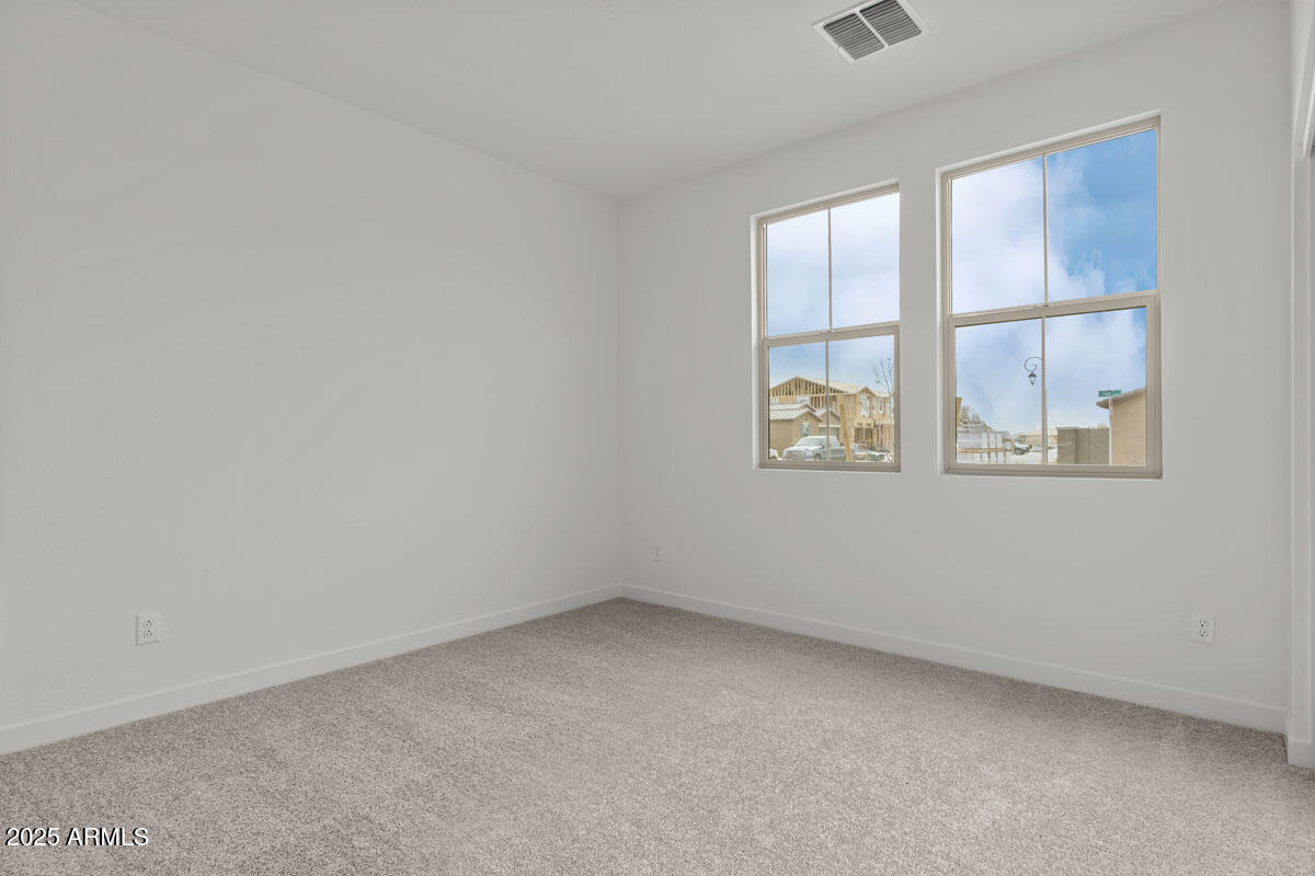 18168 West Pima Street Goodyear, AZ 85338 - Photo 8 of 21 an empty room with a window