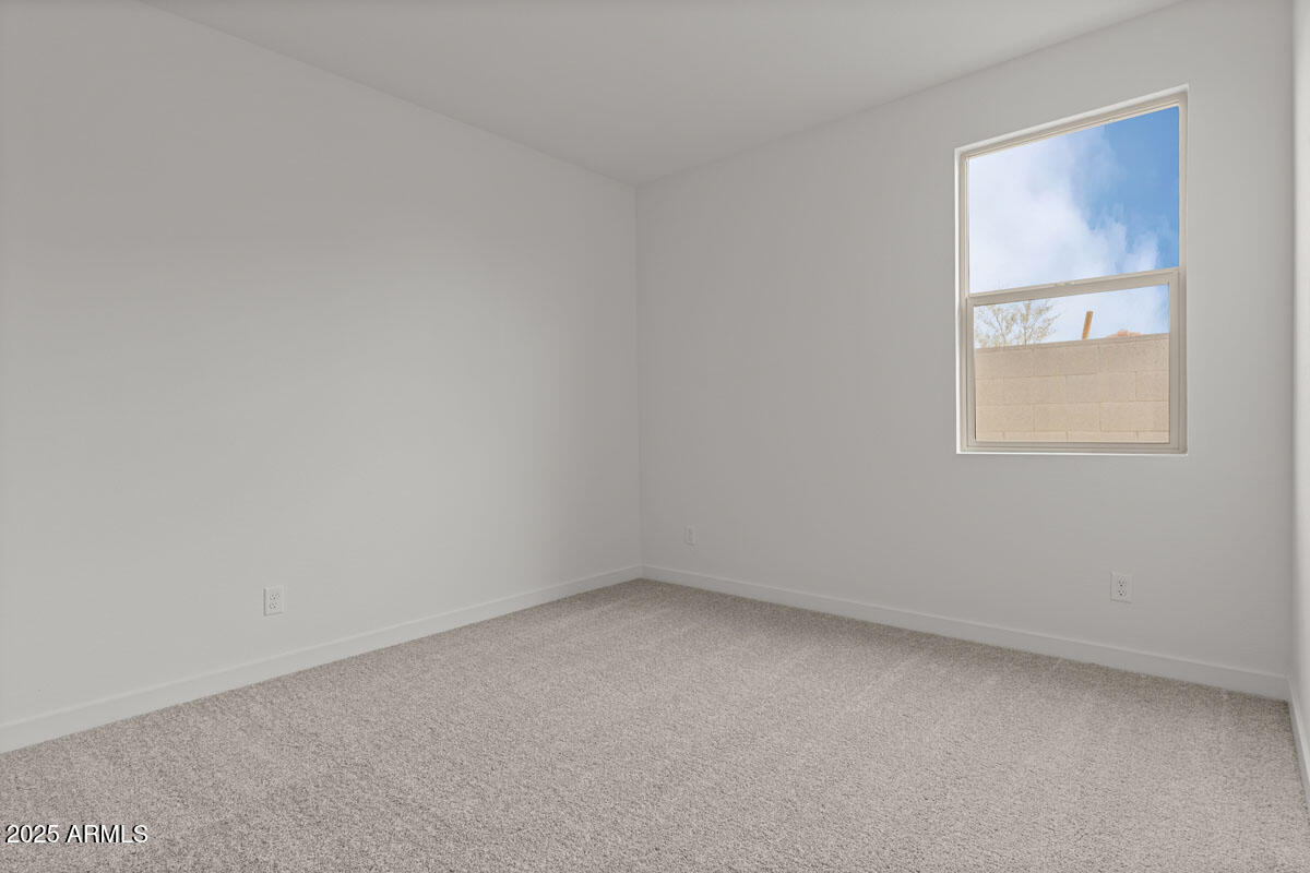 18168 West Pima Street Goodyear, AZ 85338 - Photo 10 of 21 an empty room with a window