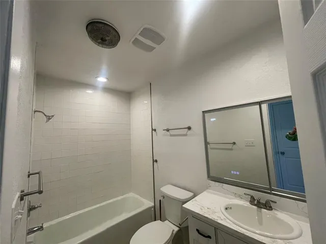 an empty room with wooden floor