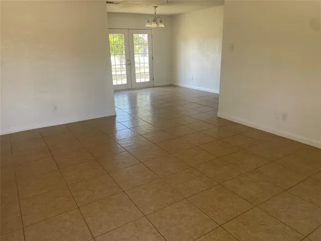 a view of a kitchen with a sink and a window