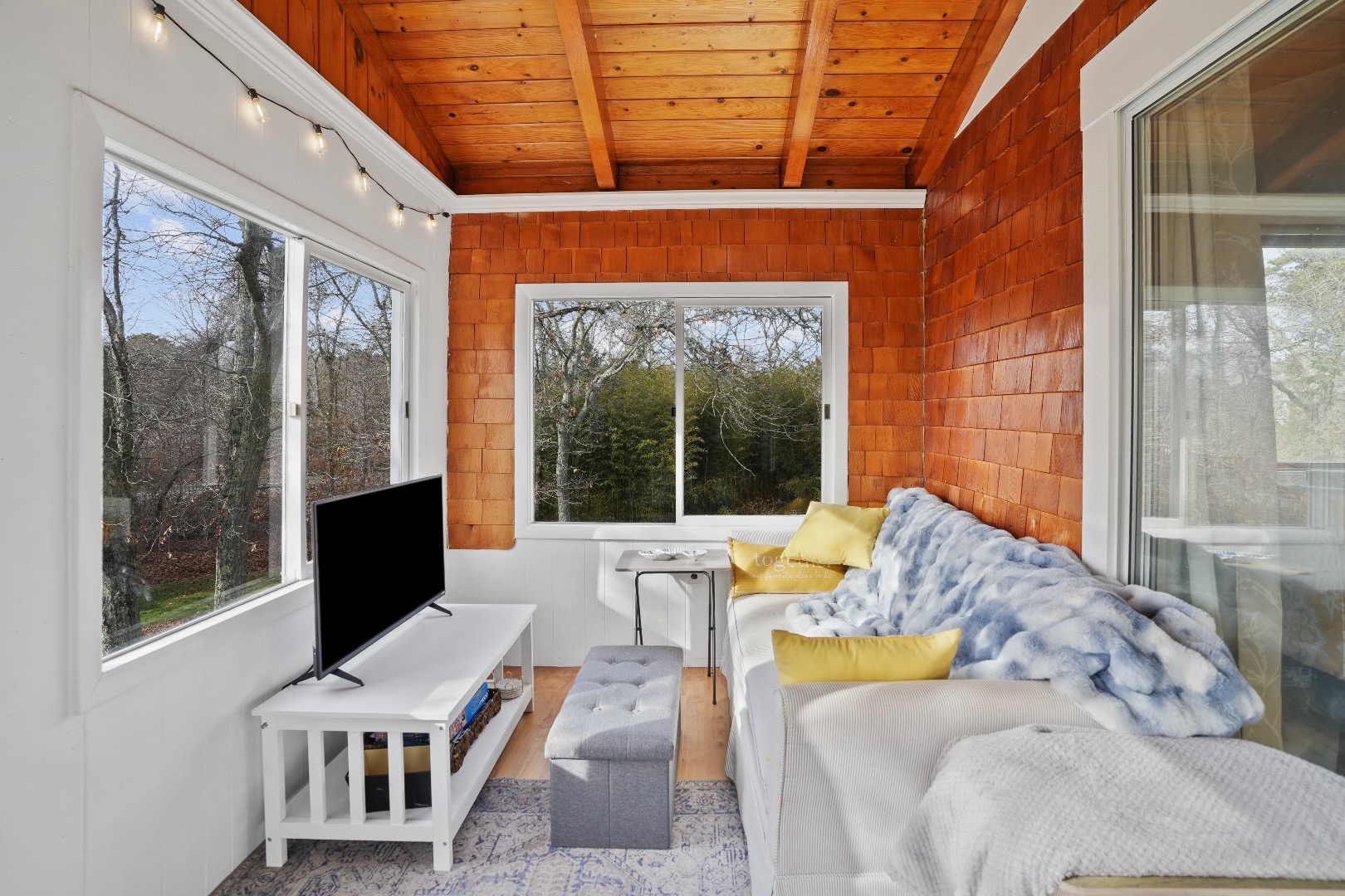 101 Tradewinds Road Oak Bluffs, MA 02557 - Photo 17 of 59 a living room with furniture and a window
