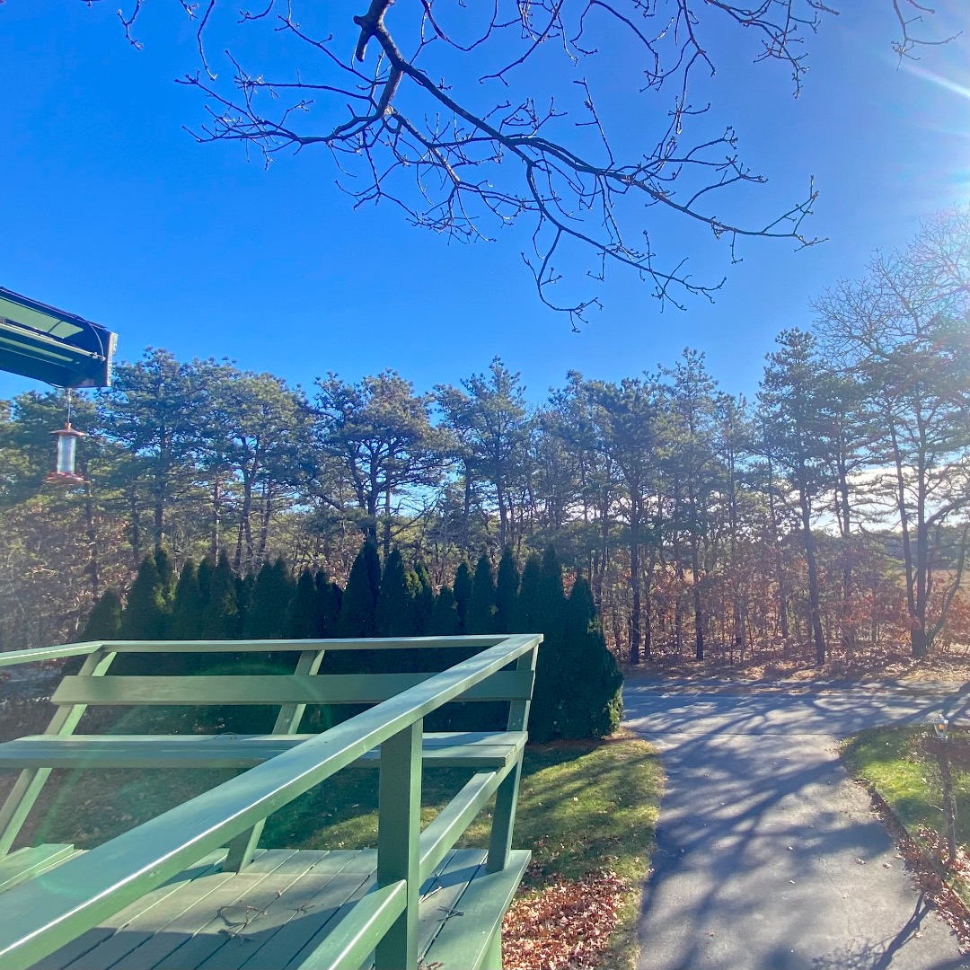 101 Tradewinds Road Oak Bluffs, MA 02557 - Photo 20 of 59 a view of a backyard with wooden fence